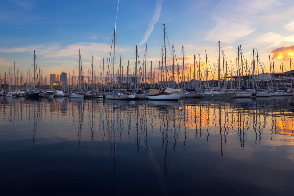 Barcelona Port Vell with Sailboat and yachts at sunrise in Barcelona, Spain