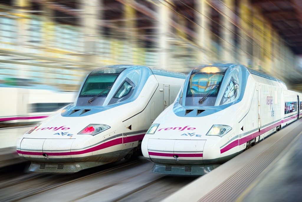 Madrid, Spain - June 08, 2017 : Modern hi-speed passenger train of Spanish Railways Company - Renfe, in  movement (motion).